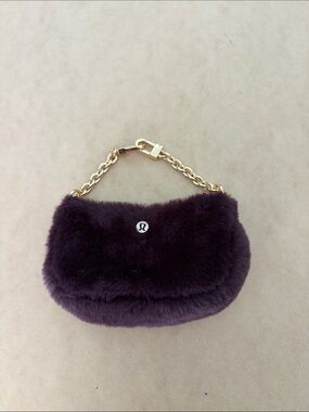 lululemon athletica Plush Faux Fur Mini Bag in Plum with Gold Chain